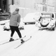A skier being pulled behind a car in Earl’s Court, London. (Photo: Terry Fincher & Michael Stroud/Express/Getty Images)